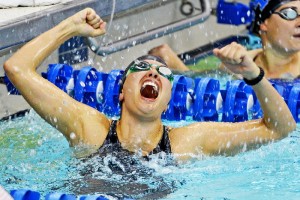 a swimmer celebrating the win