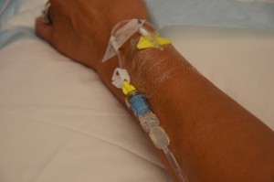 Assess IV site for patency