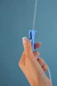 Regulate infusion with primary IV line roller clamp