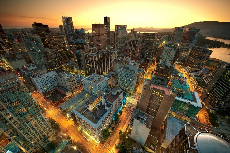 The Vancouver skyline at night is shown here.