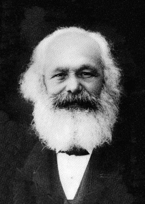 A black and white photo of Karl Marx.