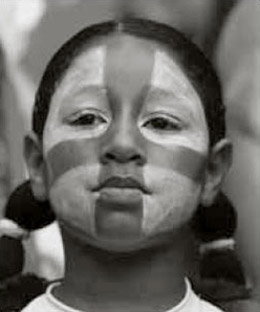 A young girl with her face painted