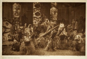 A staged photograph from a Kwakwaka'wakw potlatch in the early 20th century shows the survival and resilience of northwest coast cultural practices. (Photo by Edward Curtis.)