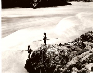 Stó:lō men dipnetting for salmon on the Fraser River. Prime locations for fishing like this were the property of lineages to use and share as they liked.