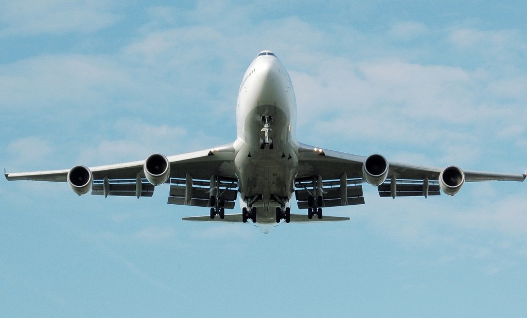 A large airplane in flight. Taken from below.