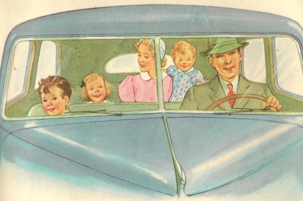 A father and son sit in the front of a car. A mother, daughter, and young child sit in the back.