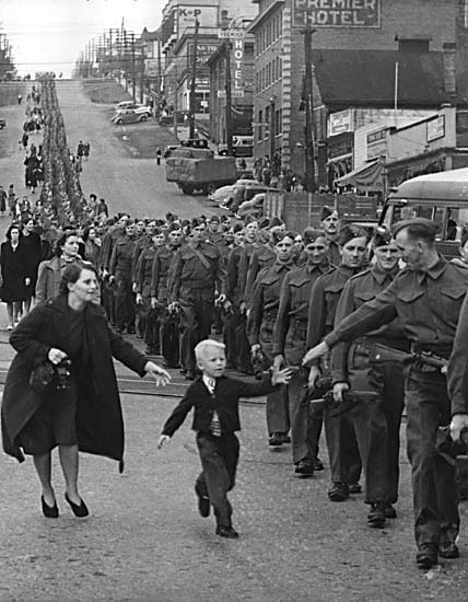 A regiment marches down a hill. Long description available.