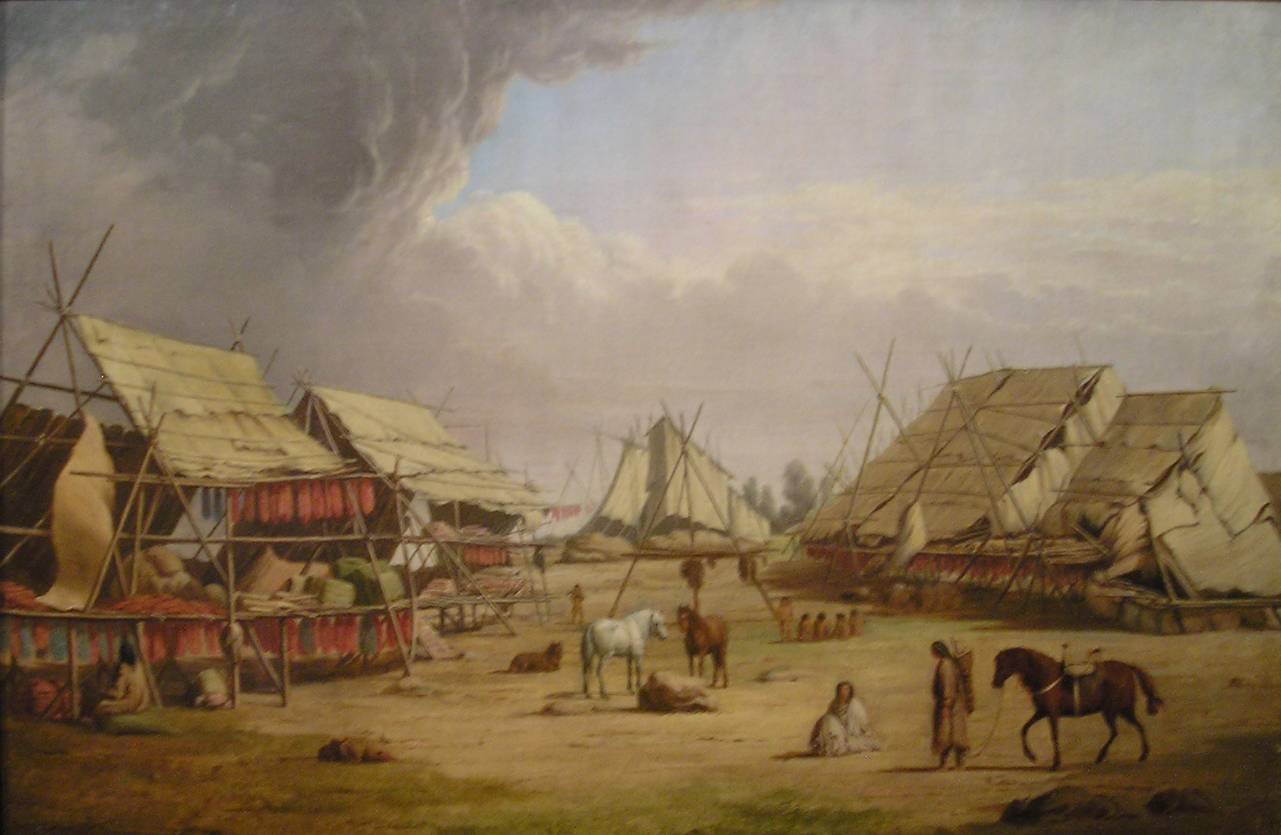 Painting of a village. Houses for drying fish are visible. Horses, dogs, and people stand.