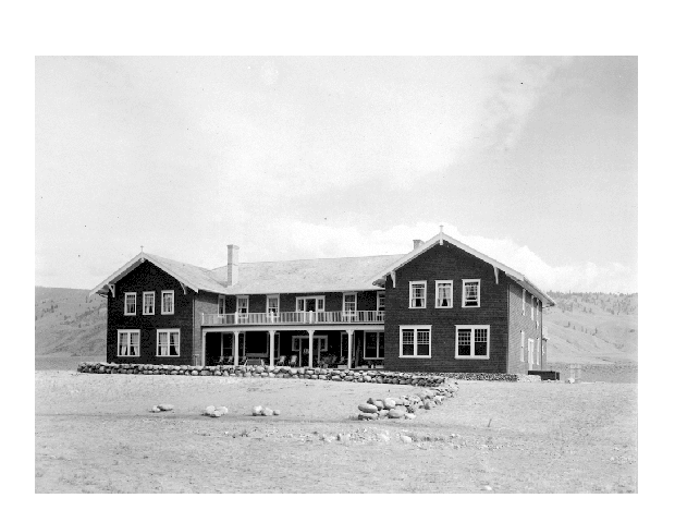 Two-story building with two wings with nothing around it in sight.