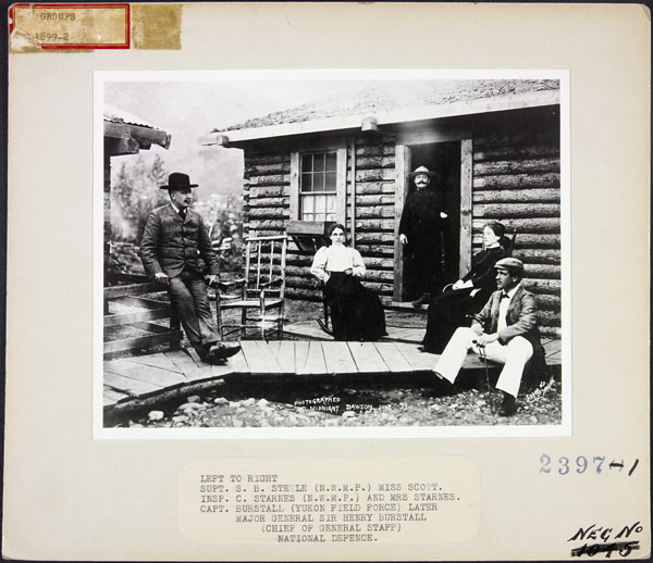 People on a cabin porch. Long description available.