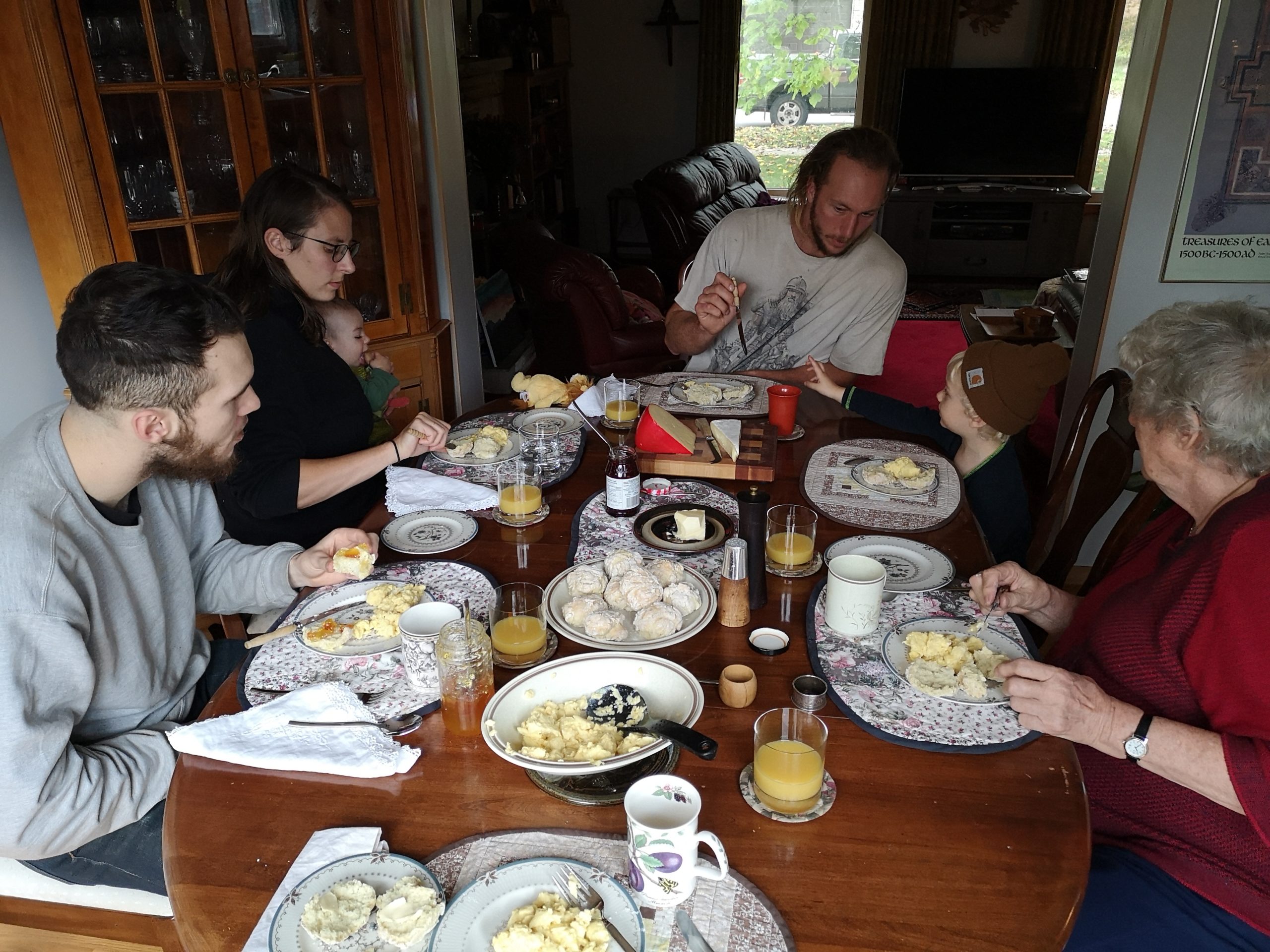 A family sitting around the dinner table eating breakfast