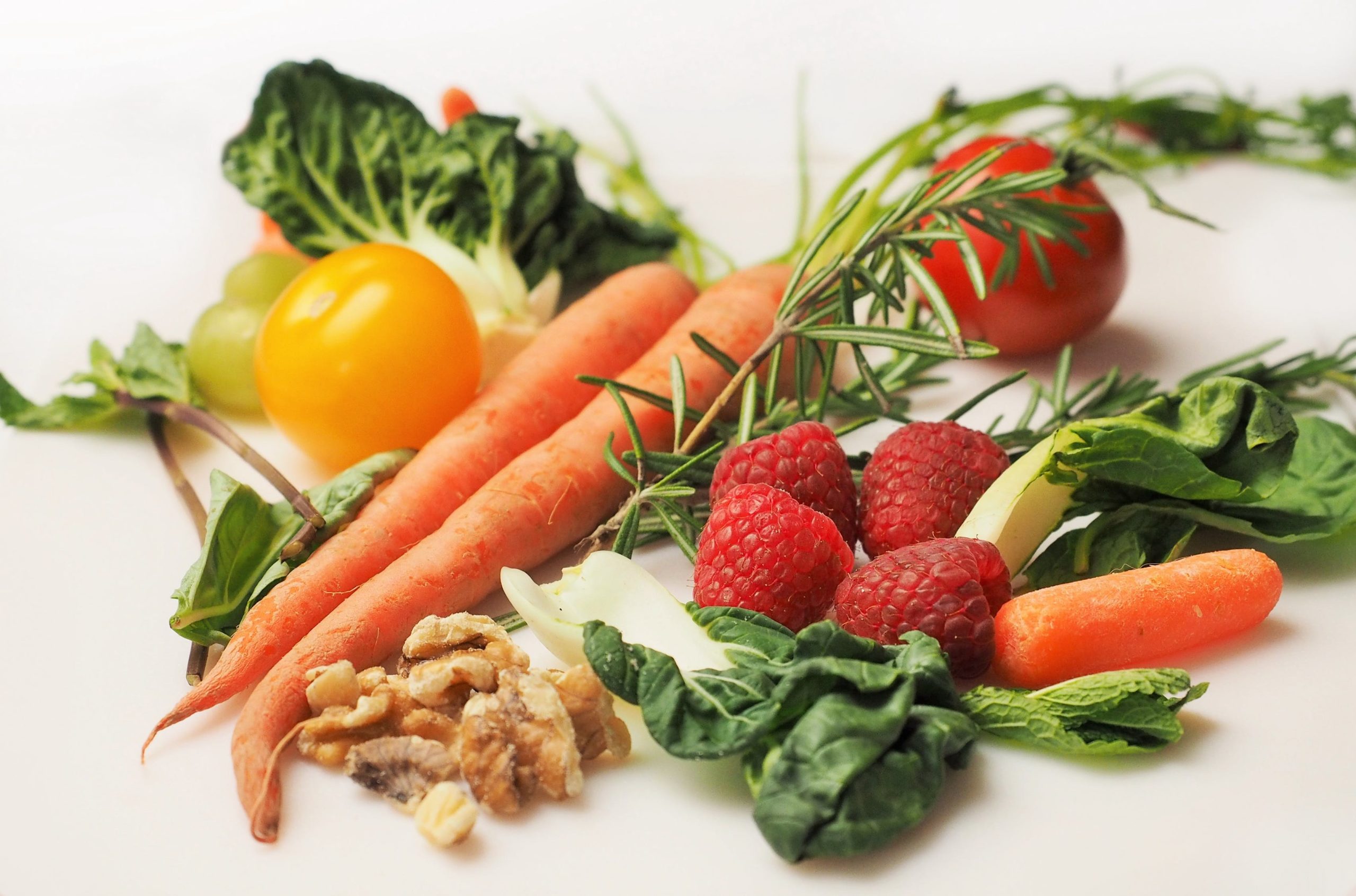 A display of fruits, vegetables, and nuts.