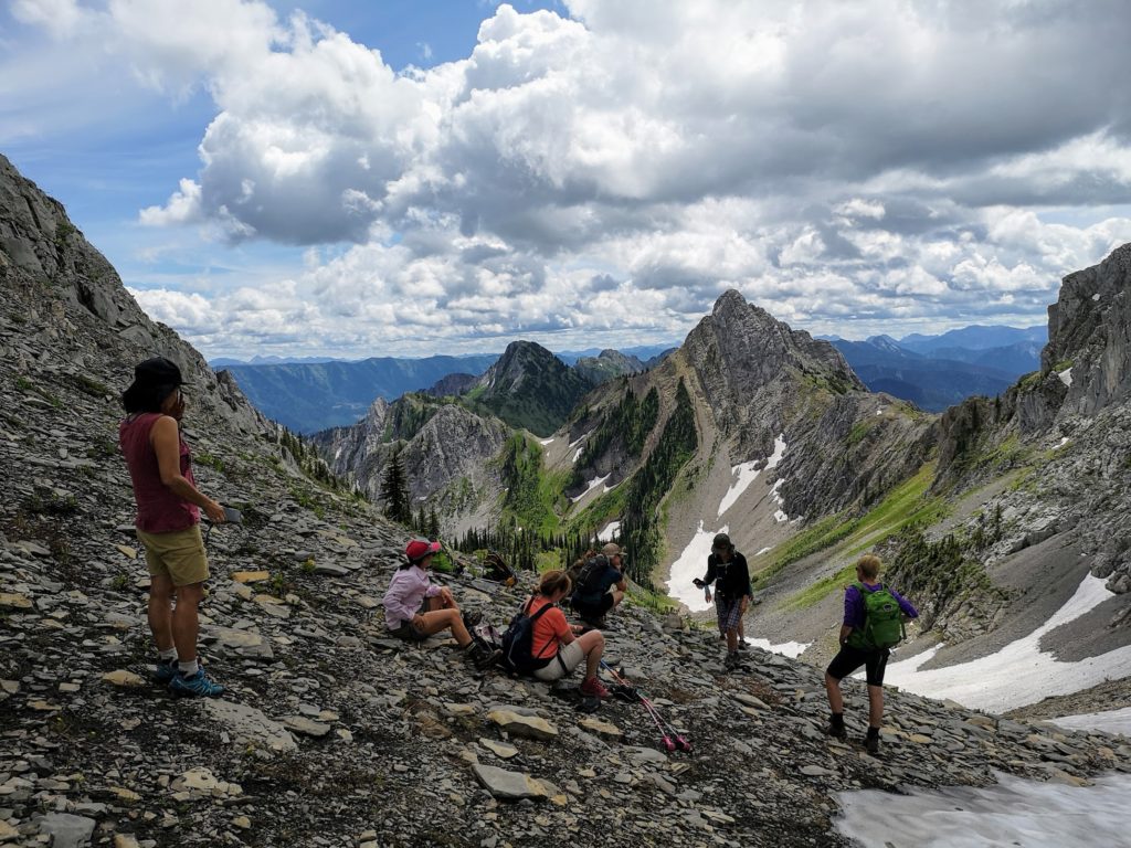 A group of people hiking in the mountains