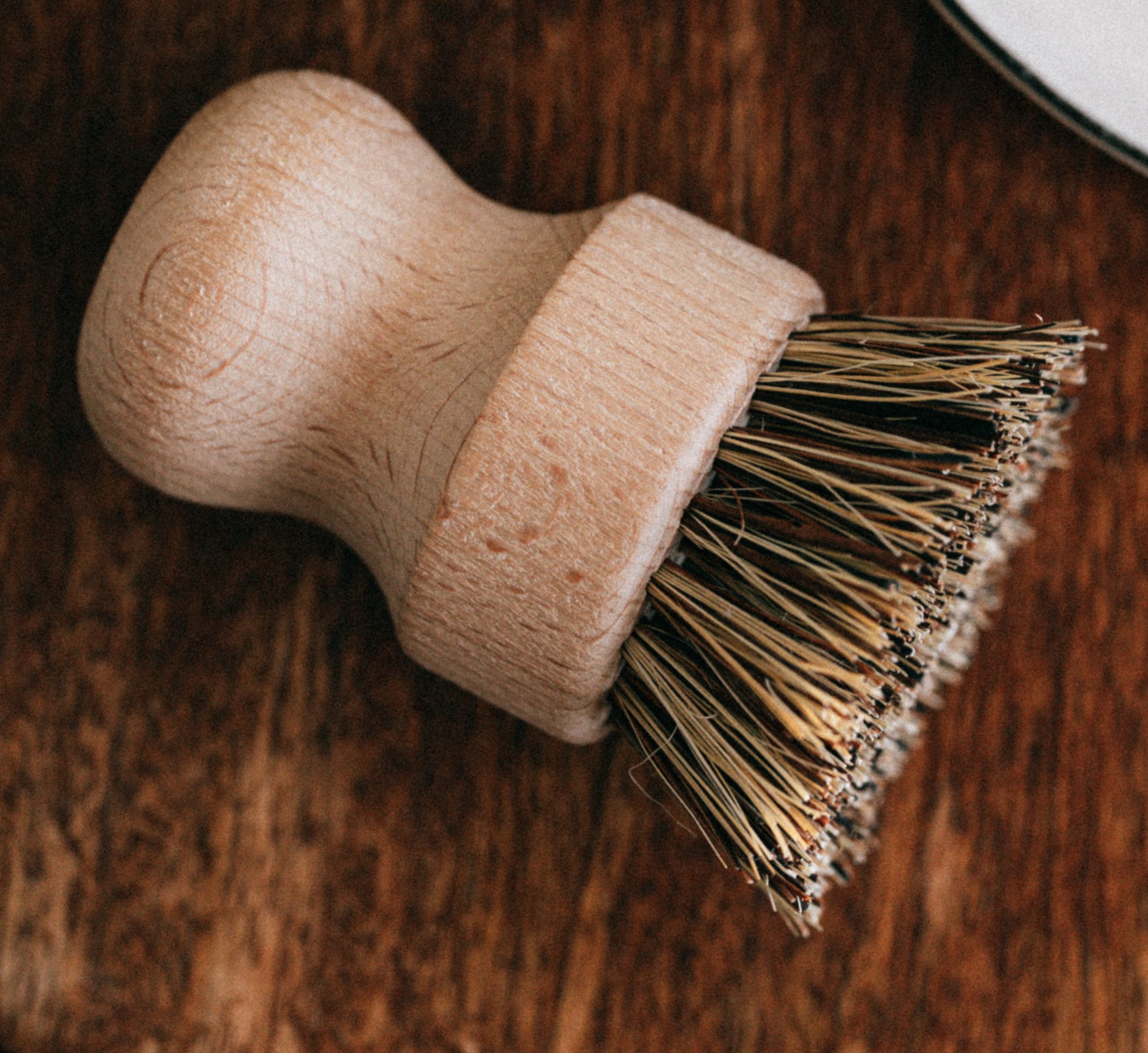A small, round brush with short bristles.