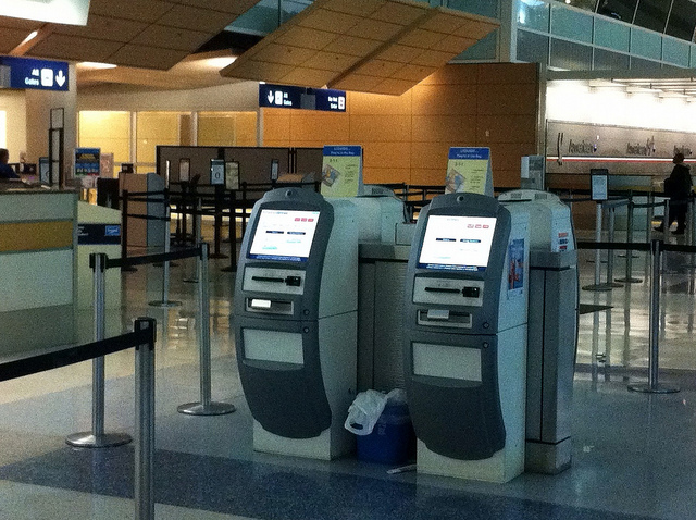 Kiosksat an airport check-in lounge.