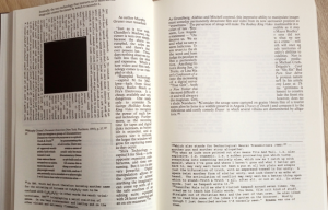 An open book showing unusual text layout, including a square of blank space in the middle of a paragraph.