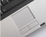 A shallowly sunken rectangle on a laptop above two rectangular buttons.