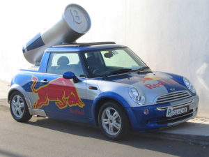 A car with the Redbull logo sprinted on the side