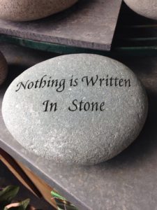 A stone with writing &quot;nothing is written in stone&quot;