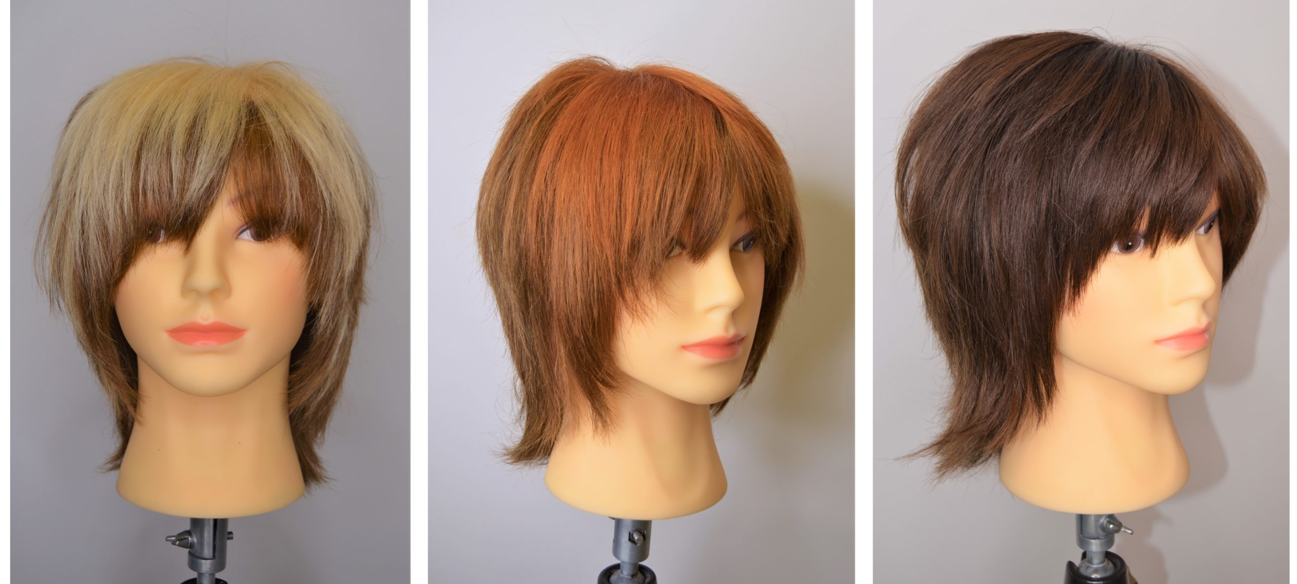 A mannequin with blonde, red, then dark brown hair.