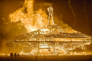 Photo of a giant burning effigy of a man on top of a space ship like structure