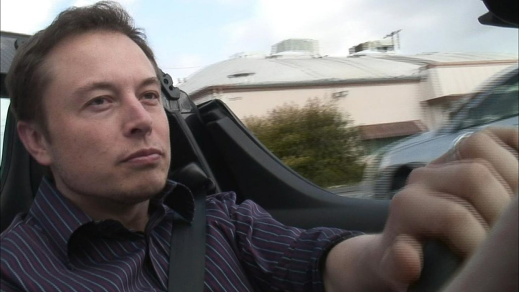Tesla Chairman Elon Musk driving a Tesla