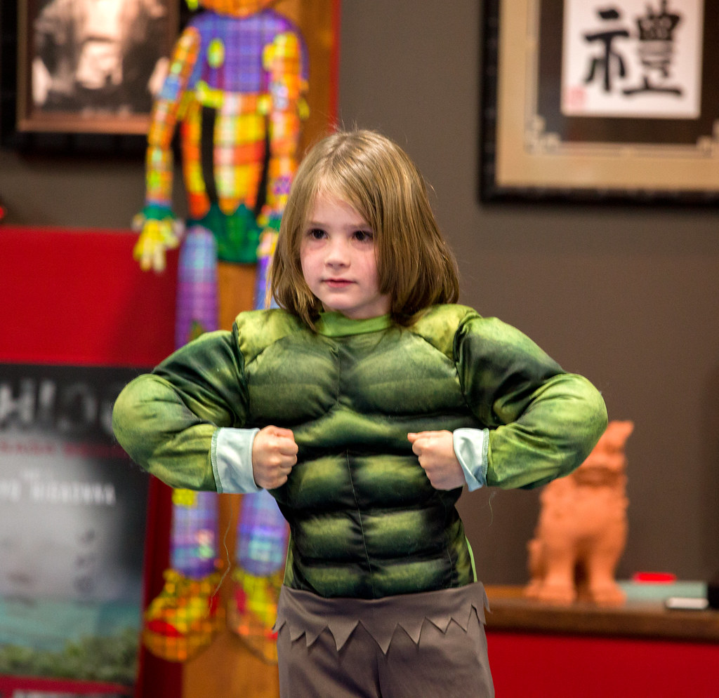 Young boy with suprhero muscle costume