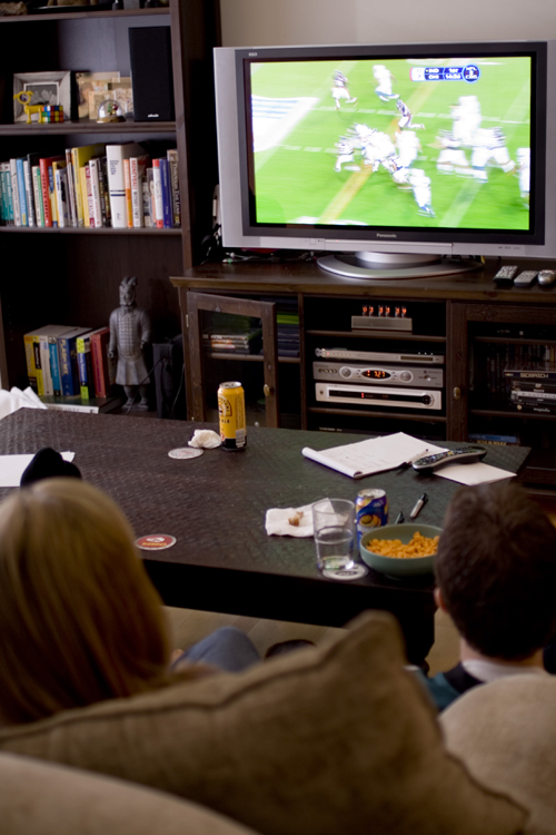 Kids watching football on TV
