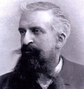 Photo of Gustave Le Bon in profile with large dark beard and moustache.