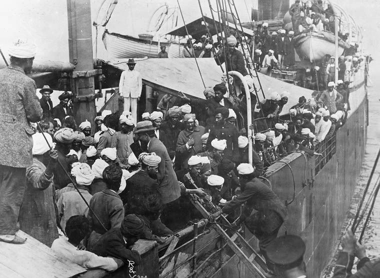 People board an already crowded ship.