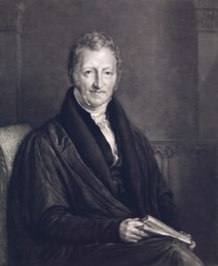 Black and white drawing of 68 year old Thomas Malthus from 1834 sitting and facing the viewer with book on lap.
