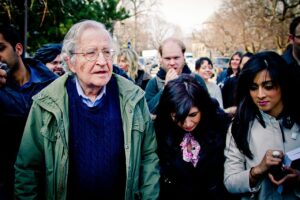 Noam Chomsky standing with a crowd of students at the University of Toronto, April 2011.
