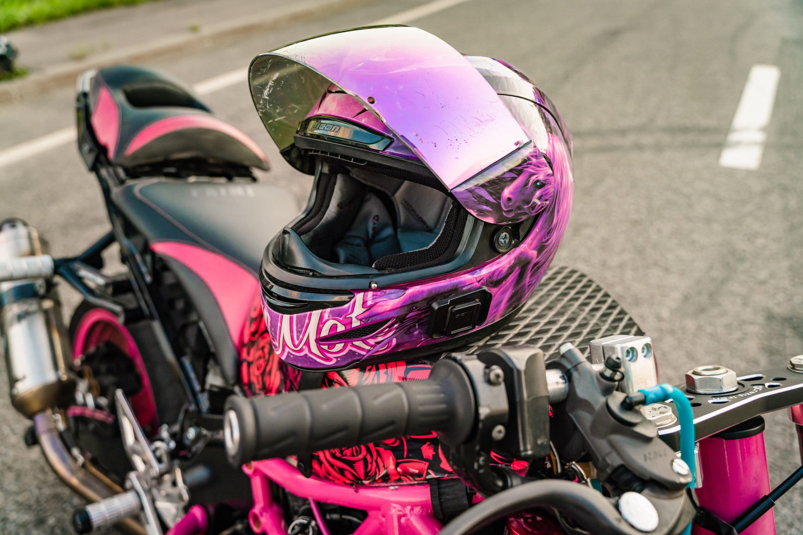 Pink Helmet on Pink and Black Motorcycle