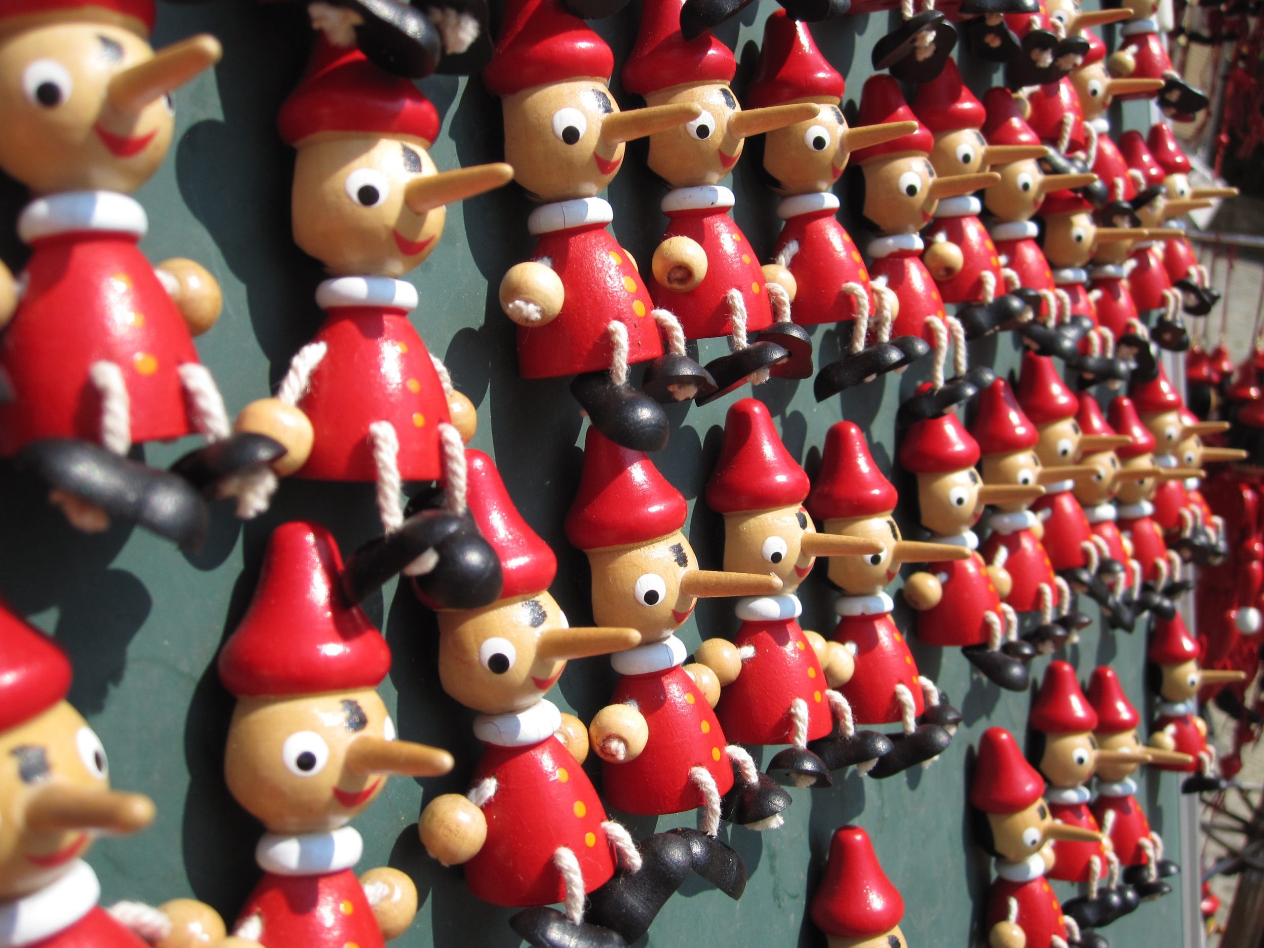 Rows of identical Pinocchio figures.