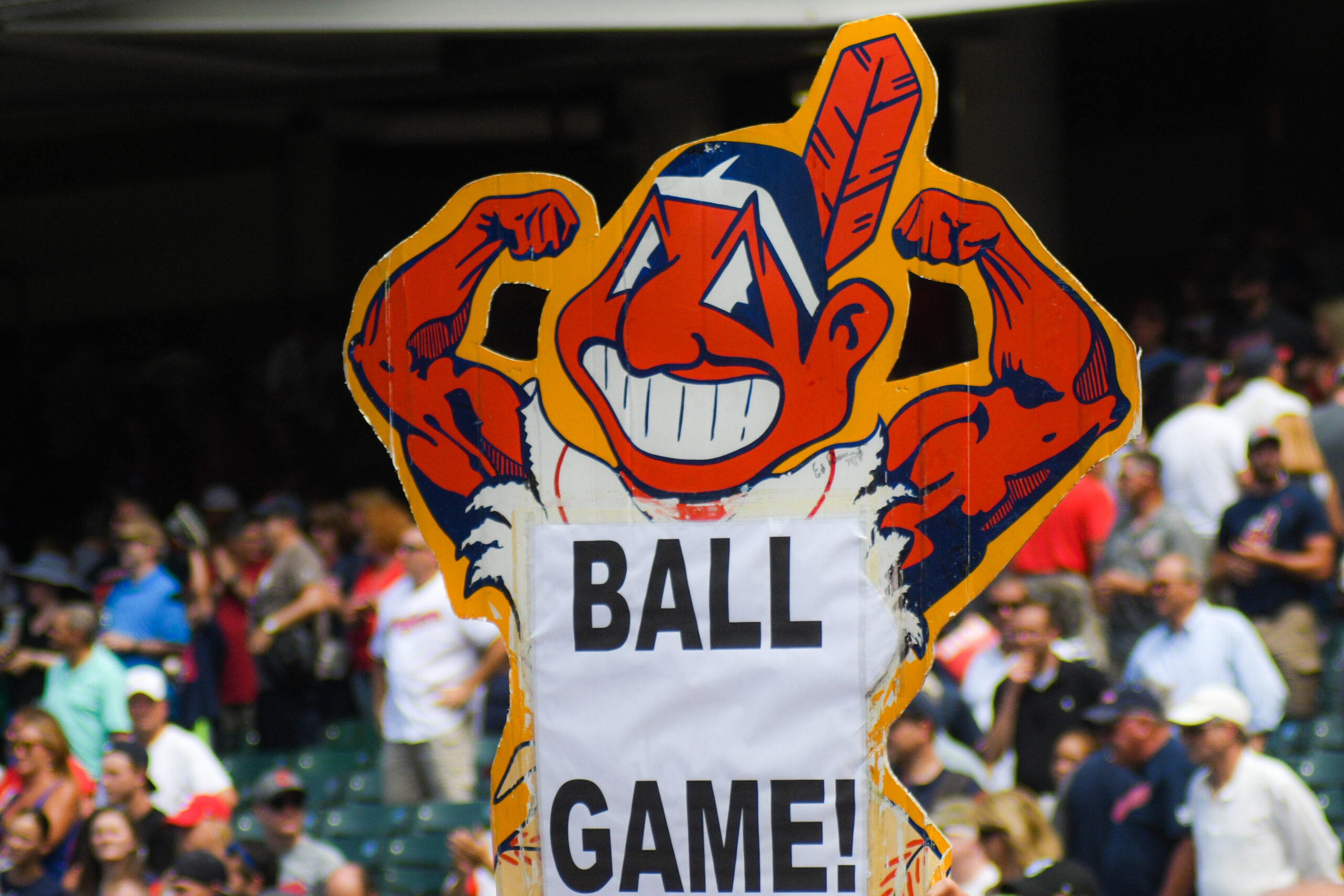 The Cleveland Indians mascot, which shows a caricature of an Indigenous person with bright red skin and a feather in their hair, flexing their biceps.