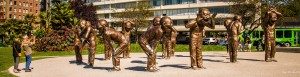 14 bronze statues standing 3 meters tall express different states of laughter.