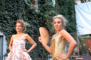 Two girls looking proud in their fancy dresses.