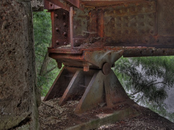 Rusted metal support beams.