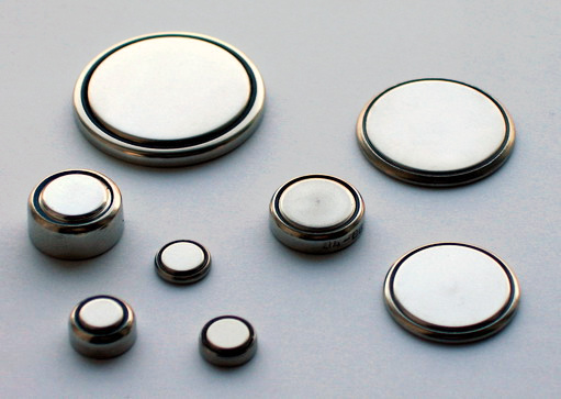 Button batteries like those seen here can be used for a variety of portable electronics, from watches and hearing aids to handheld gaming devices. Source: “Coin Cells” by Gerhard H Wrodnigg is licensed under the Creative Commons Attribution-Share Alike 2.5 Generic license.