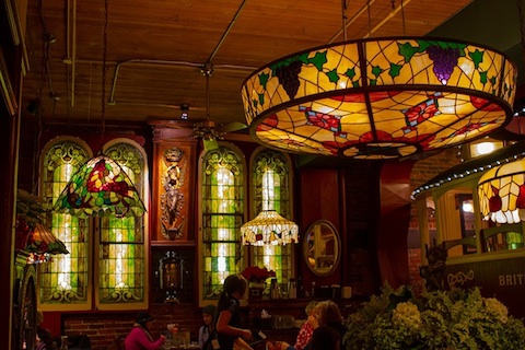 This restaurant has mandy stained glass windows and stained glass lights.