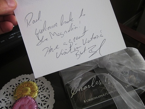 Chocolates and a handwritten note welcoming the guest back to Victoria.