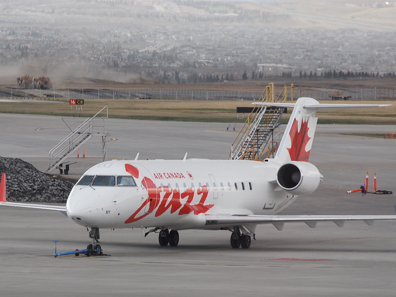 An airplane sits on a runway.