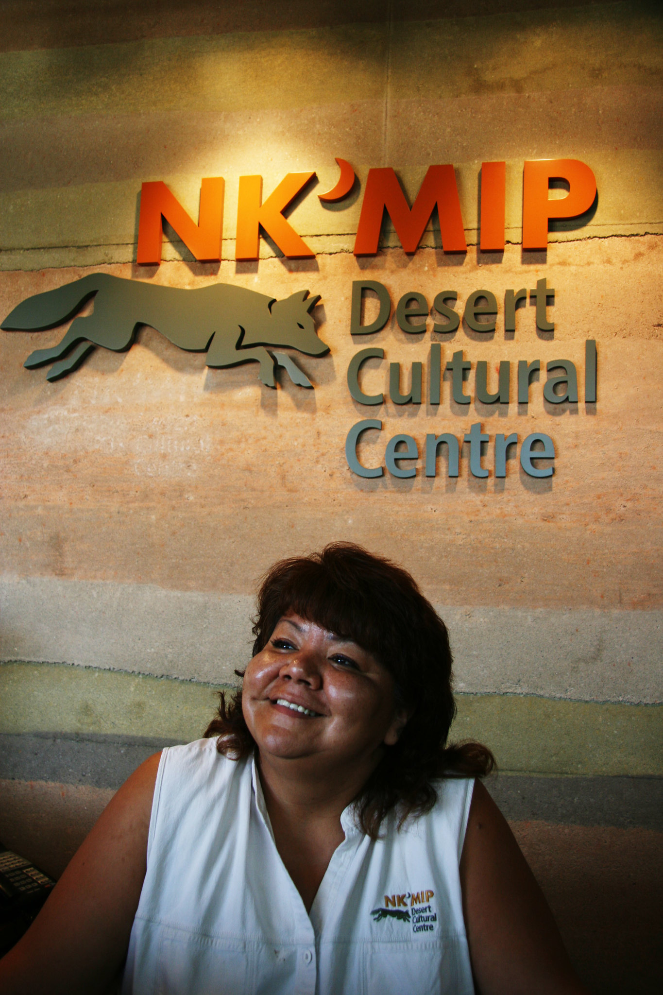 A smiling front desk employee.