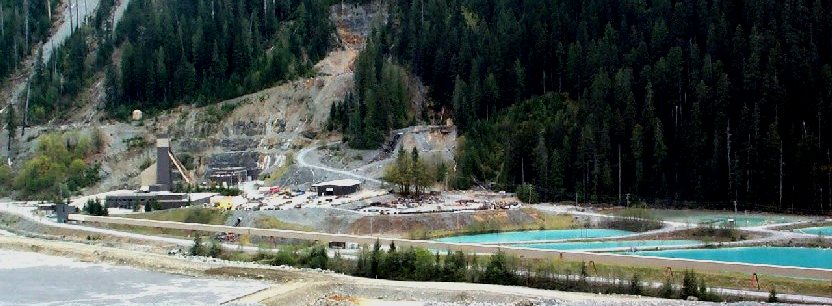 Figure 20.13 The tailings pond (lower left) at Myra Falls Mine with settling ponds (right) for processing water from the concentrator. [SE]