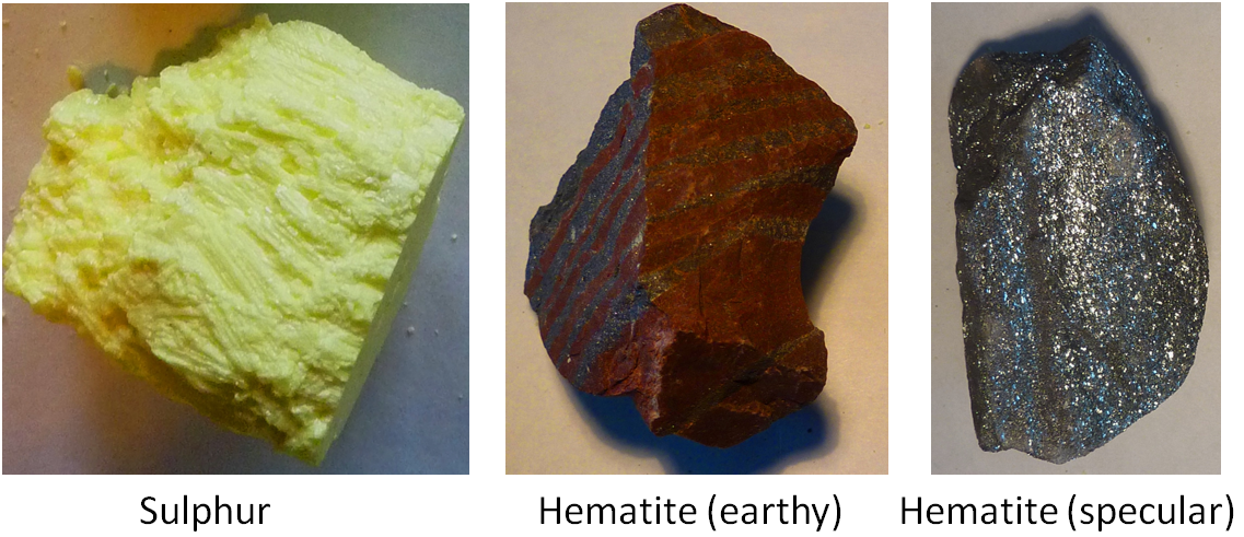 The piece of sulphur is bright yellow. One piece of Hematite is a redish brown and the other is a silvery metalic colour.