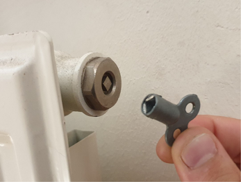 The bleed key has two loops at the top for a handle and the key itself is a diamond, matching the radiator bleed valve.