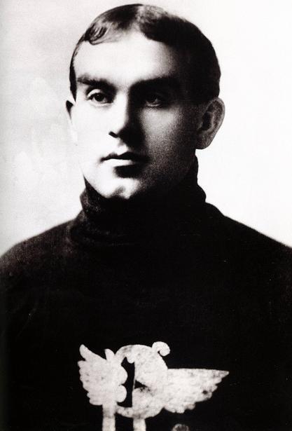 A photo portrait of a young man in a hockey sweater.
