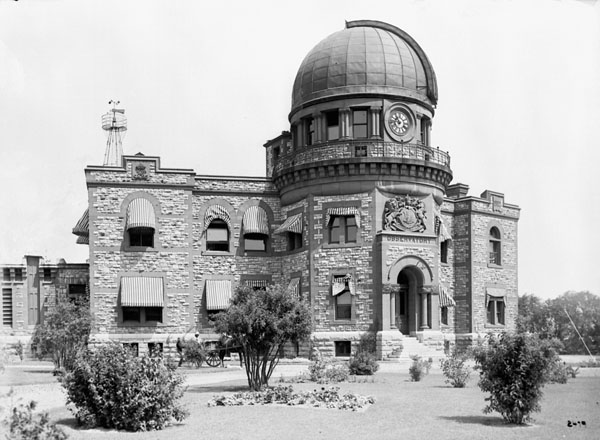 Observatory with a stone facade and a dome on the top.