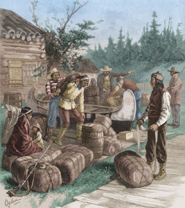 Indigenous and European people at a trading post surrounded by piles of supplies and a canoe