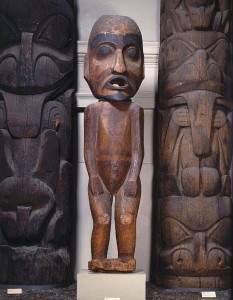 A large carved wooden figure with an opening for its mouth.